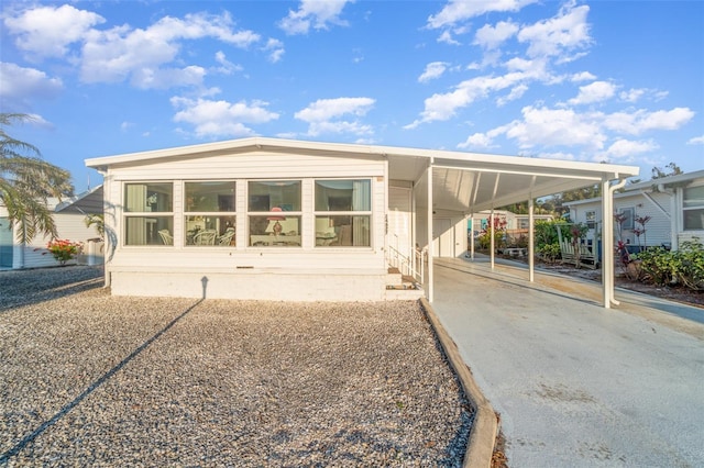 manufactured / mobile home featuring a carport