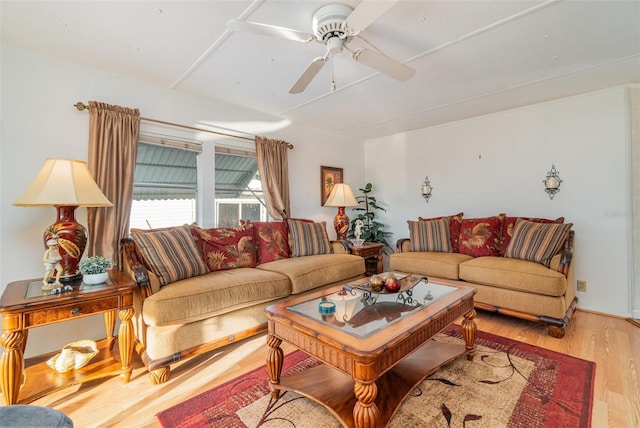 living room featuring ceiling fan and light hardwood / wood-style floors