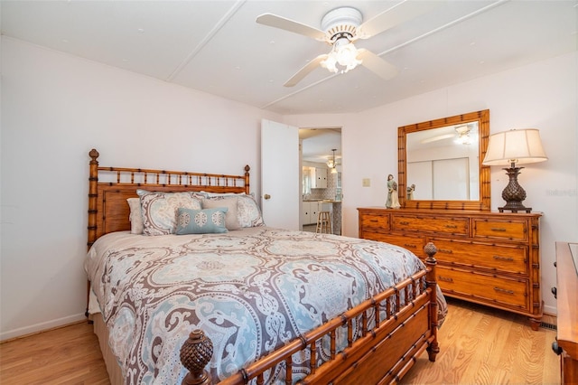 bedroom featuring ceiling fan and light hardwood / wood-style floors