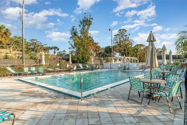 view of swimming pool featuring a patio area