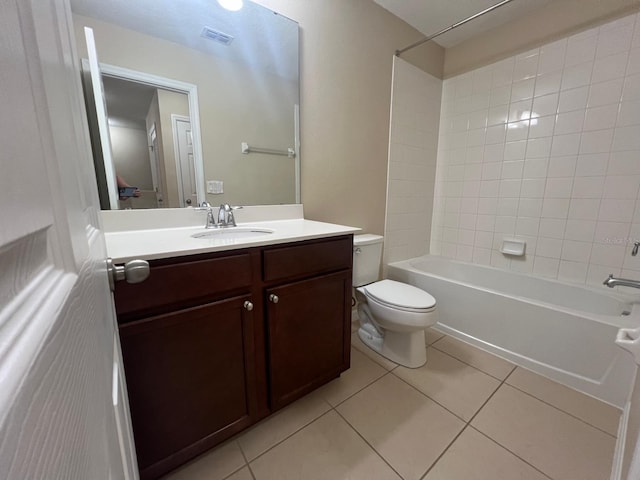 full bathroom with vanity, tile patterned floors, toilet, and tiled shower / bath