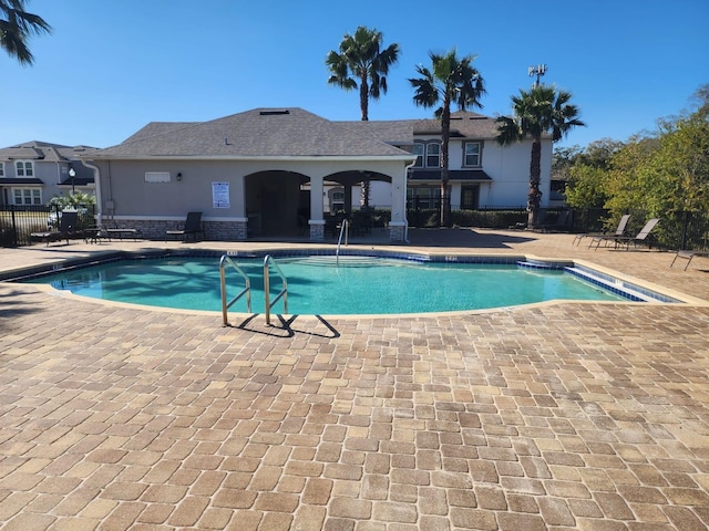 view of swimming pool featuring a patio area