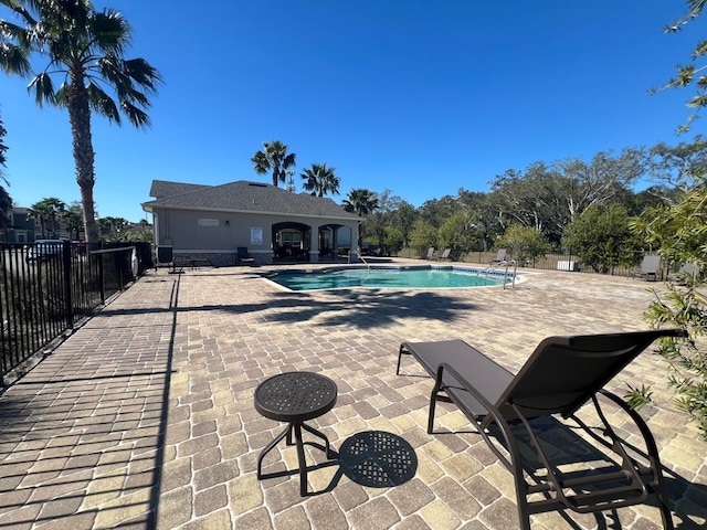 view of swimming pool with a patio