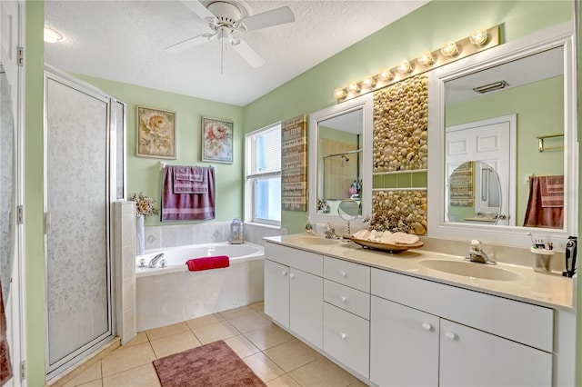 bathroom featuring vanity, tile patterned floors, ceiling fan, a textured ceiling, and separate shower and tub