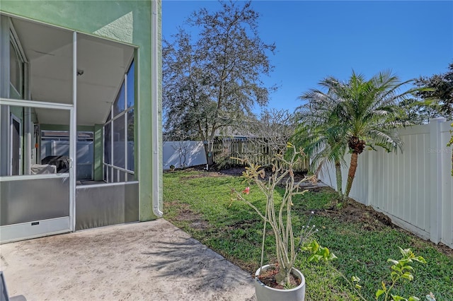 view of yard featuring a lanai and a patio