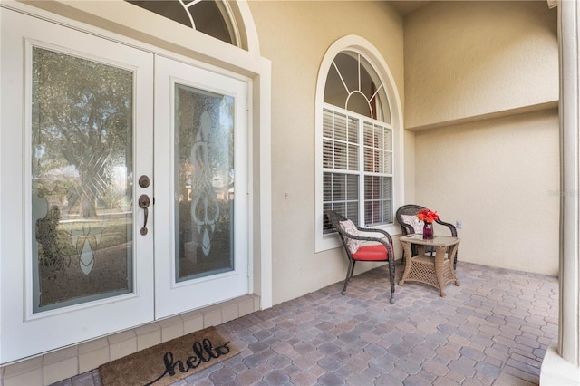 view of exterior entry featuring french doors