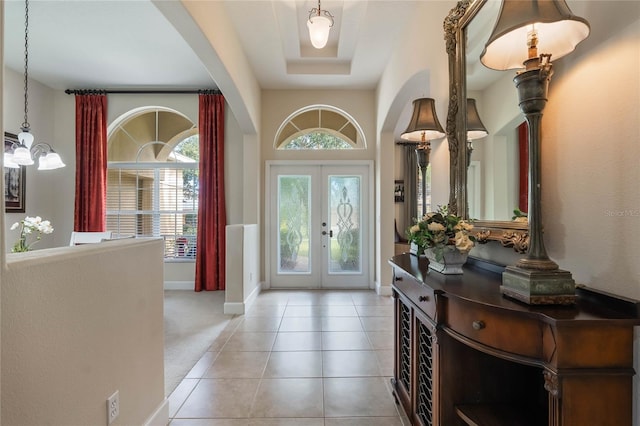 tiled entrance foyer featuring french doors