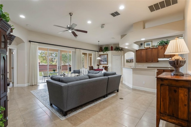 living room featuring ceiling fan and light tile patterned floors