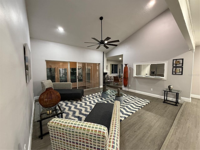 living room featuring high vaulted ceiling, ceiling fan, and wood-type flooring