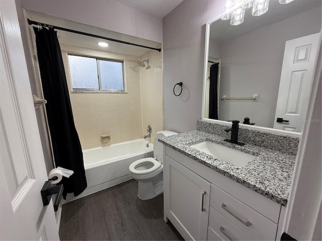 full bathroom featuring hardwood / wood-style flooring, toilet, vanity, and shower / bathtub combination with curtain