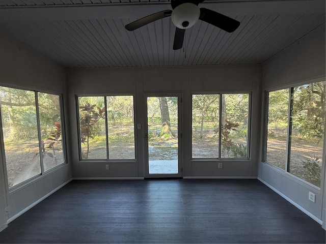 unfurnished sunroom with ceiling fan