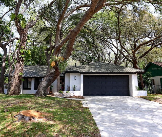 1461 Lancelot, Casselberry, FL 32707 - view of front facade with a garage, driveway, and stucco siding