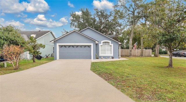 ranch-style home featuring a garage and a front yard