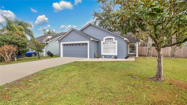 view of front of home featuring a garage and a front yard