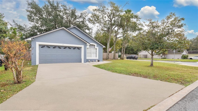 view of front of house featuring a garage and a front lawn