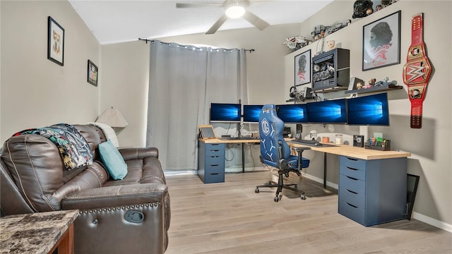 office area with ceiling fan and light hardwood / wood-style floors