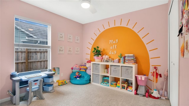 recreation room featuring carpet flooring and ceiling fan