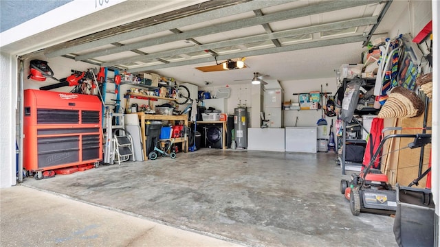 garage featuring washer and dryer, a workshop area, water heater, heating unit, and a garage door opener