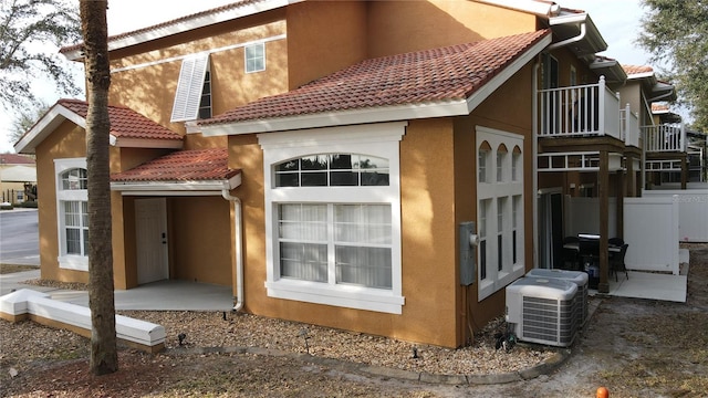 back of house with cooling unit