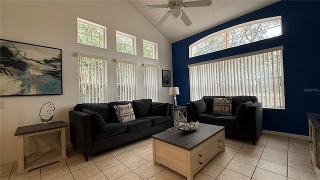 tiled living room featuring high vaulted ceiling and ceiling fan