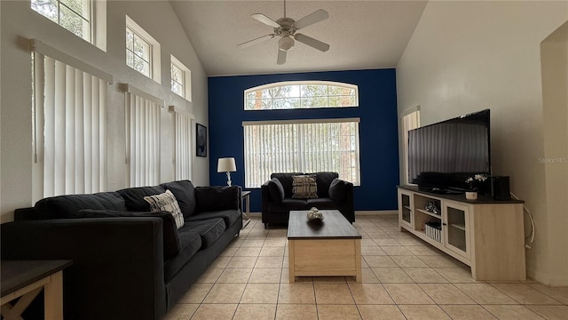 living room with light tile patterned floors, a textured ceiling, vaulted ceiling, and ceiling fan