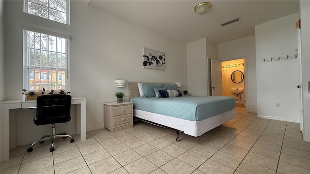 tiled bedroom with ensuite bath