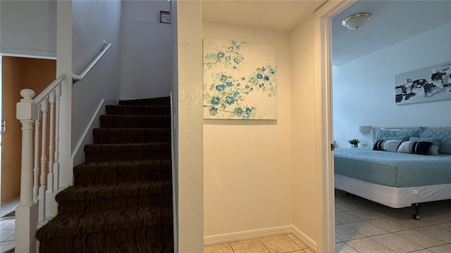 staircase with tile patterned floors