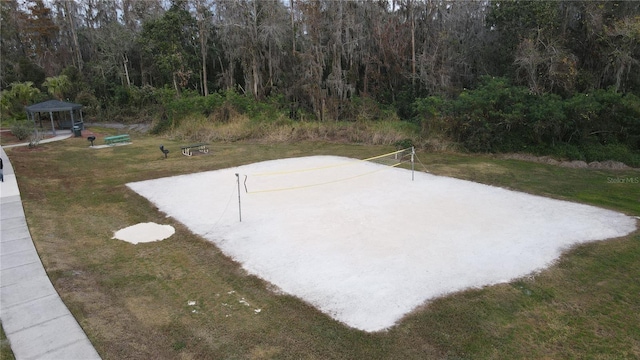 exterior space with volleyball court and a lawn