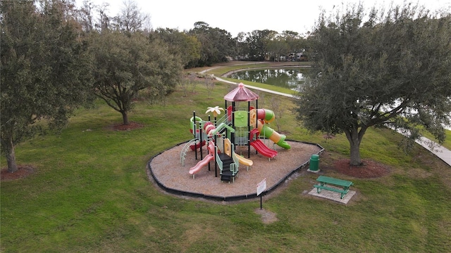 view of play area with a lawn and a water view