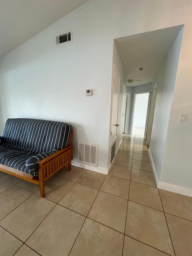 corridor with light tile patterned flooring