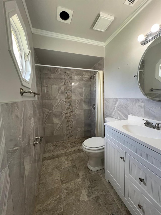 bathroom featuring a shower with curtain, vanity, crown molding, tile walls, and toilet