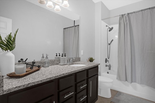 full bathroom with tile patterned floors, shower / bath combo, toilet, and vanity