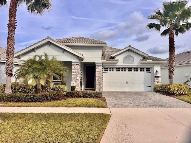 mediterranean / spanish-style home featuring a garage