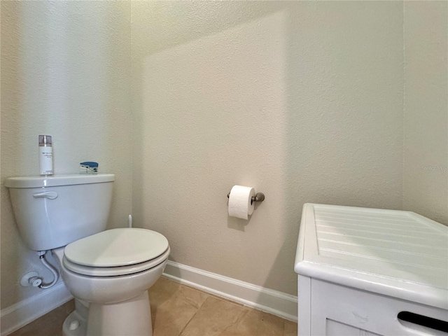 bathroom featuring toilet and tile patterned floors