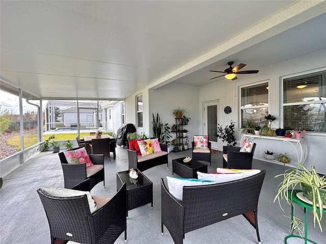 sunroom with ceiling fan