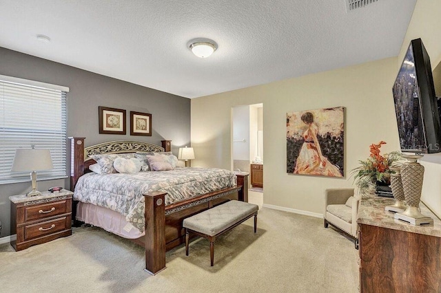 carpeted bedroom featuring a textured ceiling