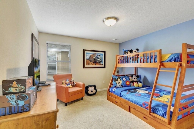 bedroom featuring carpet and a textured ceiling