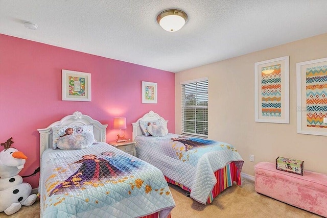 bedroom featuring a textured ceiling and light colored carpet