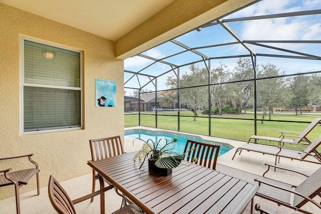 view of patio / terrace featuring a lanai