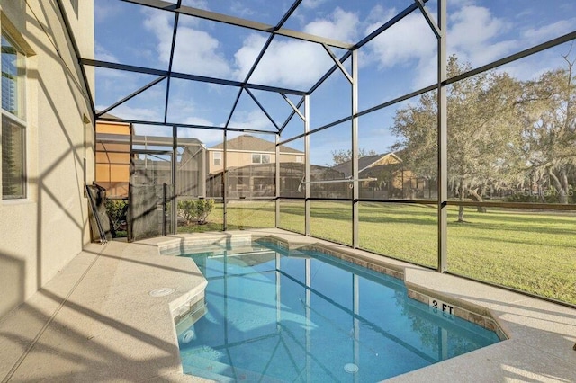 view of swimming pool featuring a lanai and a yard