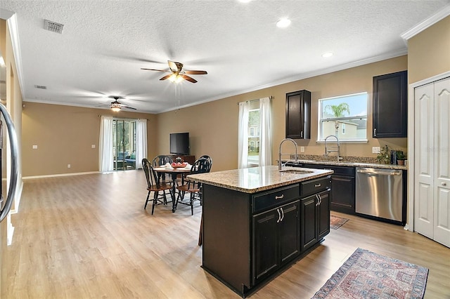 kitchen featuring a kitchen island, stainless steel dishwasher, light wood-type flooring, and crown molding