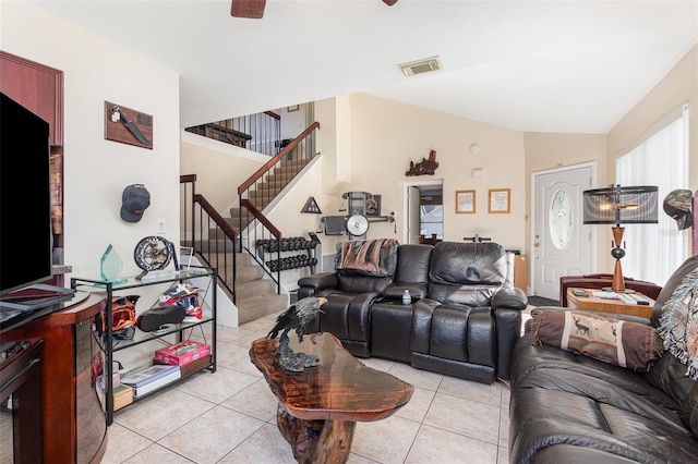 tiled living room with lofted ceiling