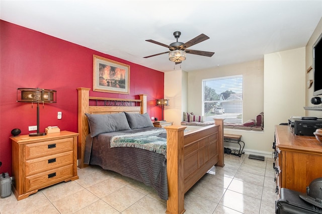 tiled bedroom featuring ceiling fan