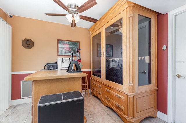 office area with ceiling fan and light tile patterned floors