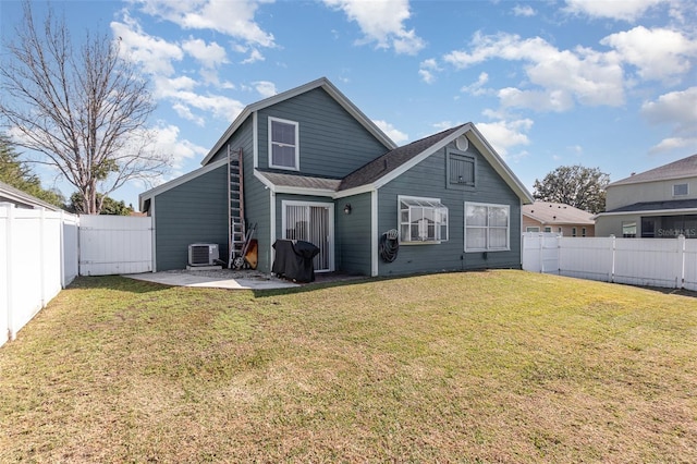 back of house with central AC unit, a lawn, and a patio