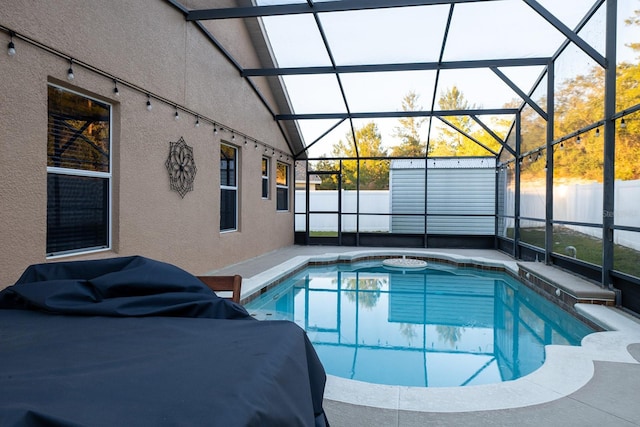 view of pool featuring a lanai