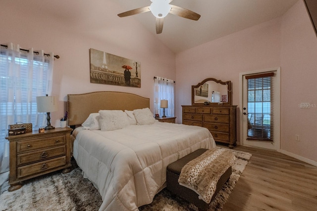 bedroom featuring high vaulted ceiling, ceiling fan, and light hardwood / wood-style flooring