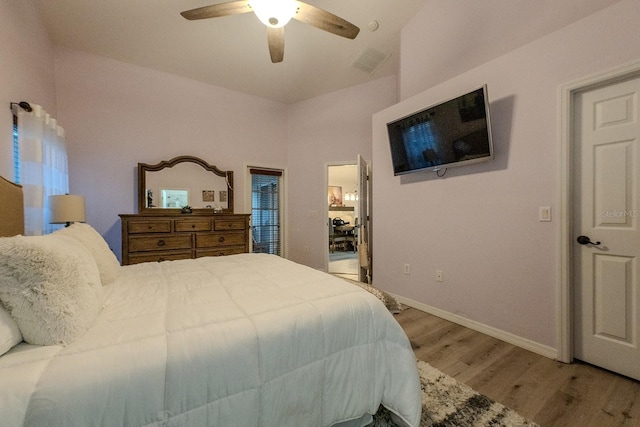 bedroom with hardwood / wood-style flooring and ceiling fan