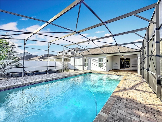 view of pool with a patio area, a lanai, and ceiling fan