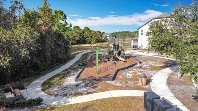 view of property's community with a playground